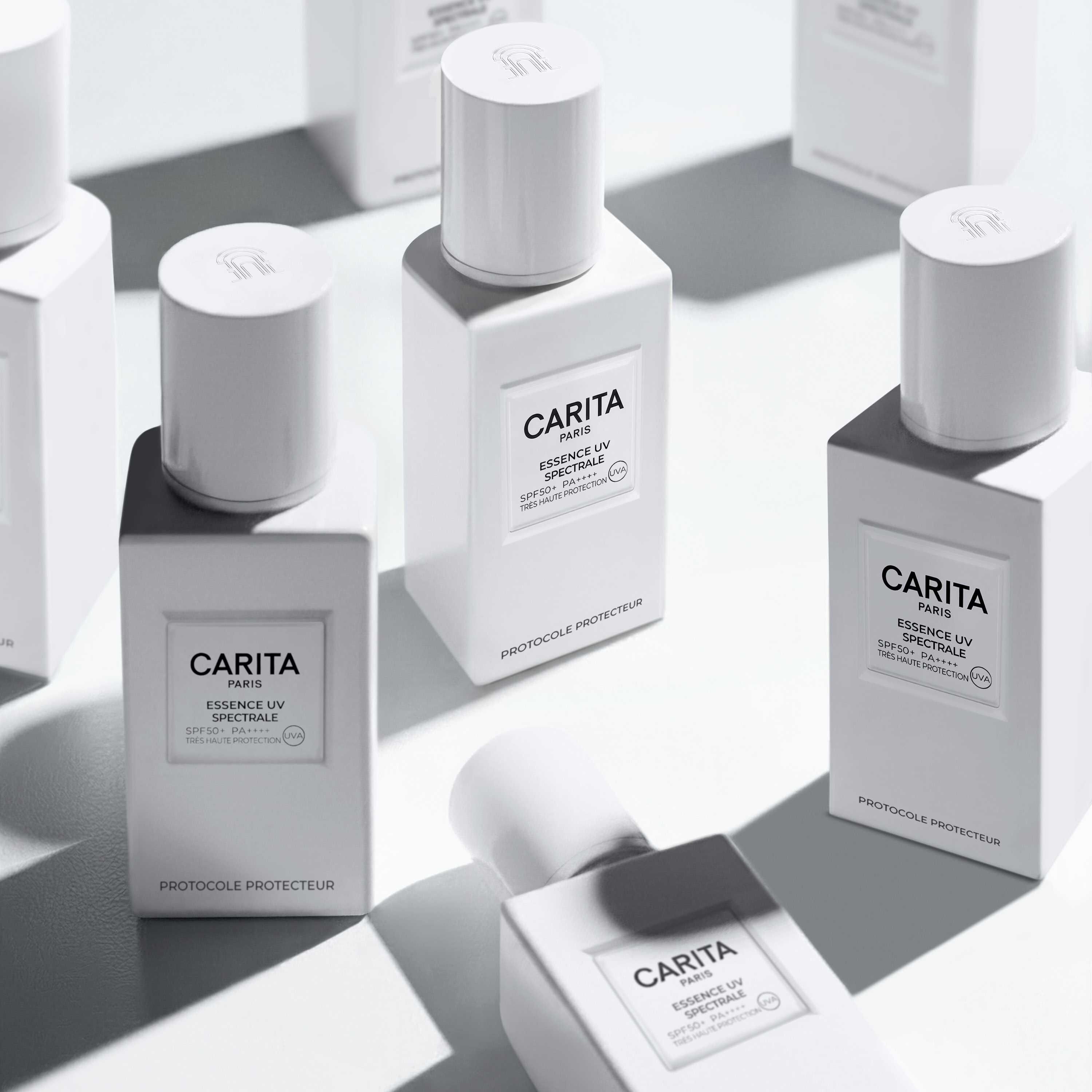Multiple Carita bottles with sharp shadows.