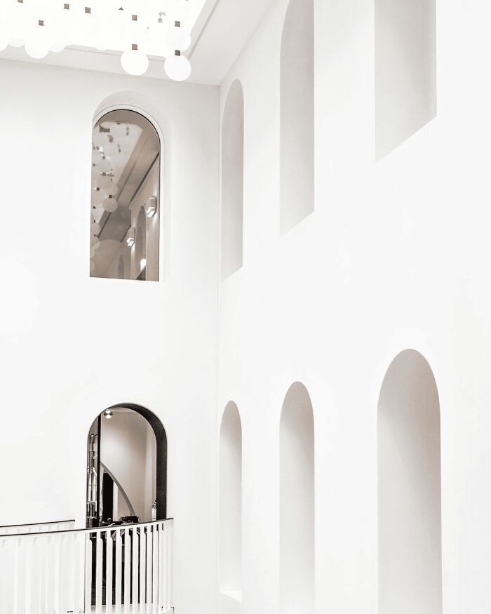 White arches and mirrors of the Carita House of Beauty.