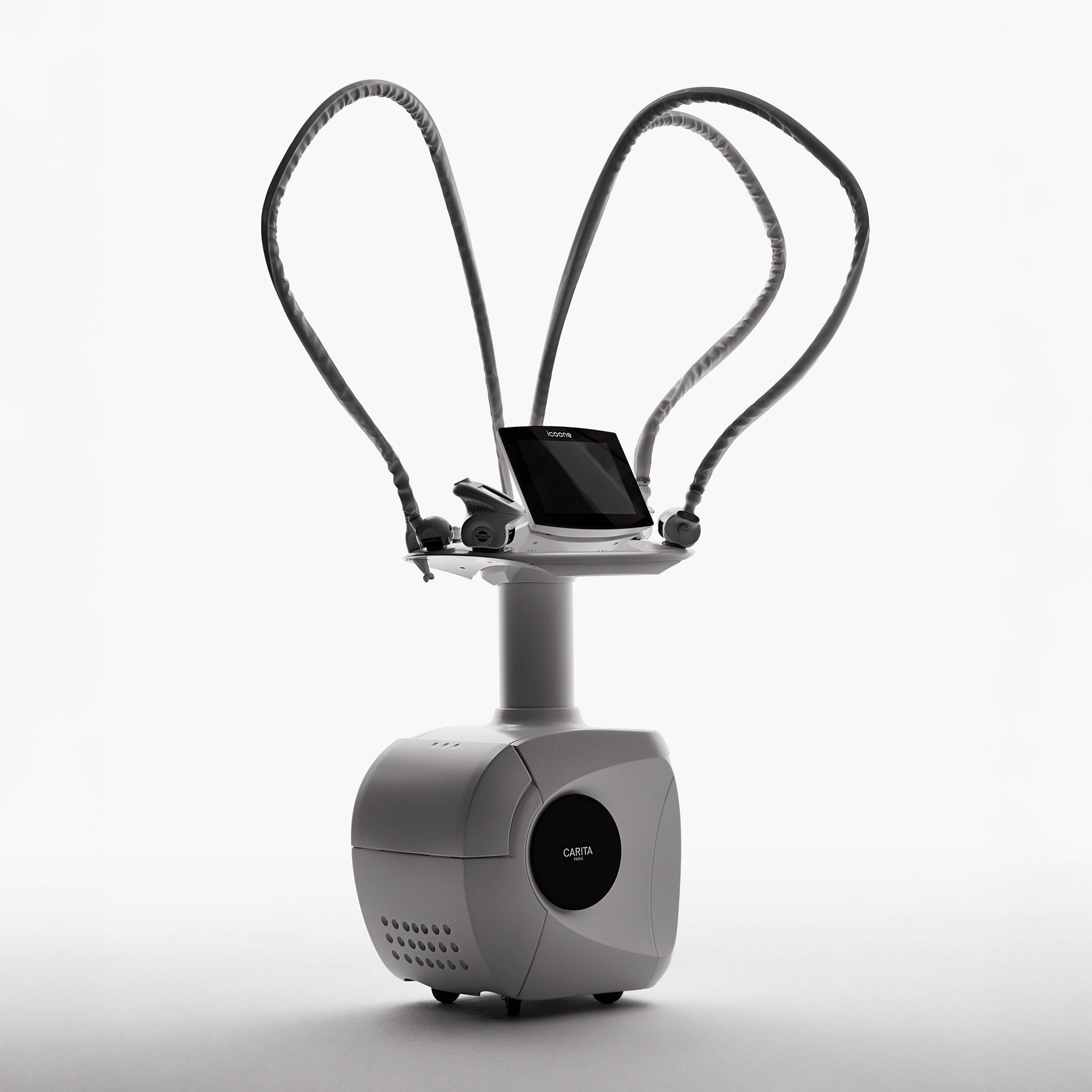 The icoone treatment station by Carita Paris: a sophisticated aesthetic device with an elegant design, featuring advanced technology for luxurious professional beauty treatments.