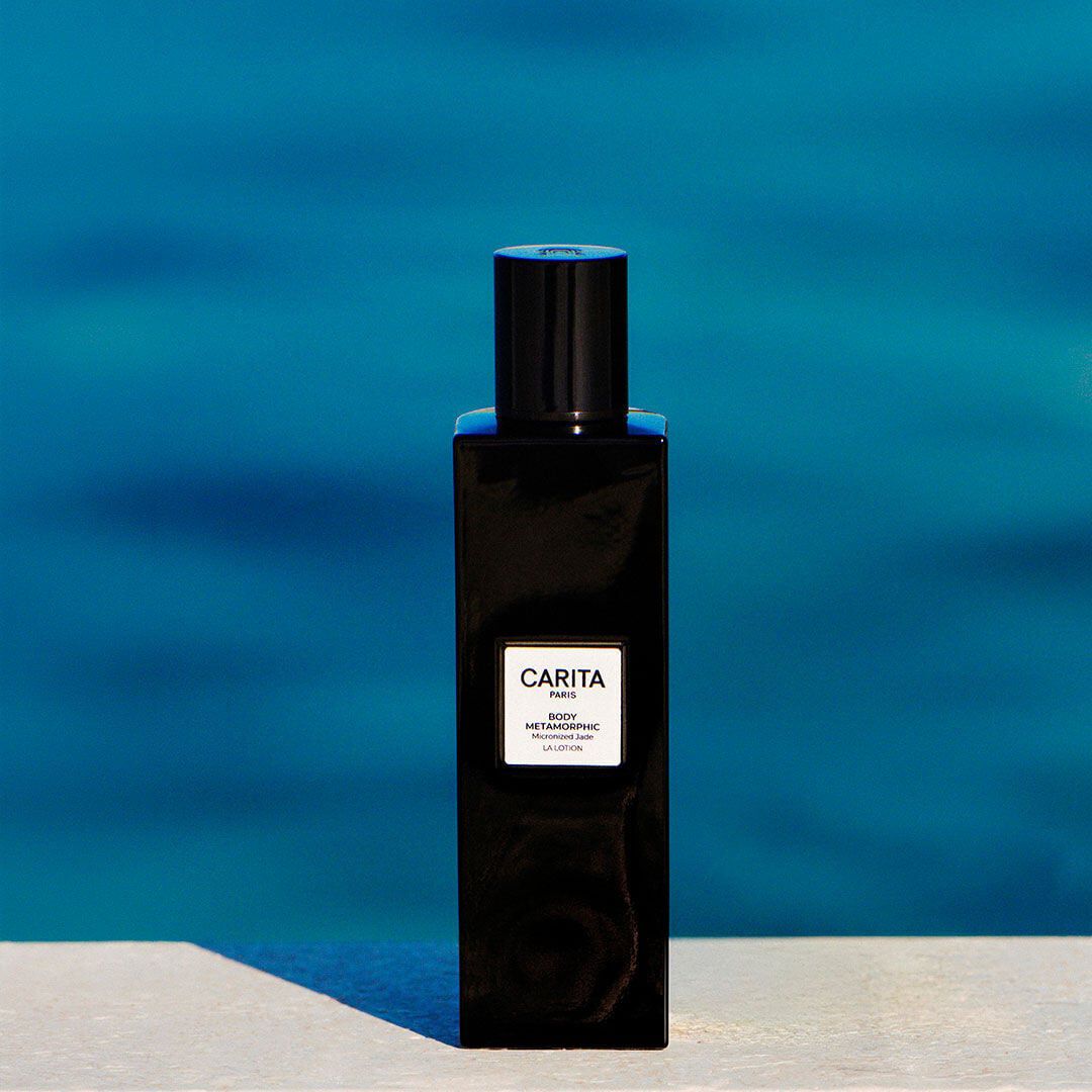 Black Body Metamorphic lotion bottle on an azure background.