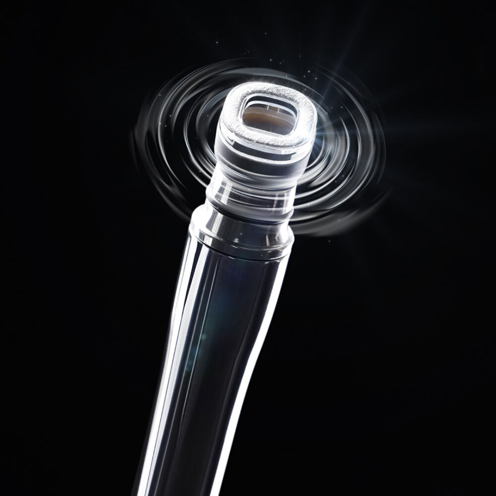 A close-up of a shiny, metallic nozzle with a swirling light effect, set against a dark background.
