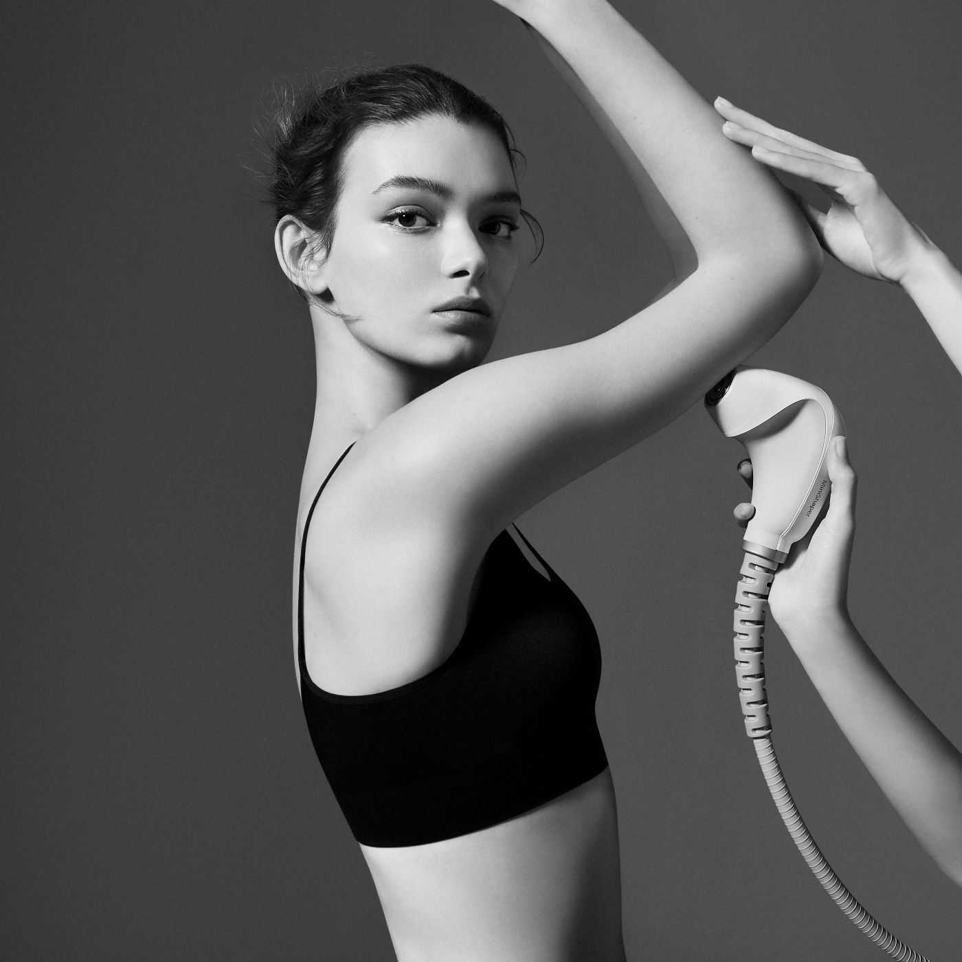Black and white radiofrequency treatment on the arm.