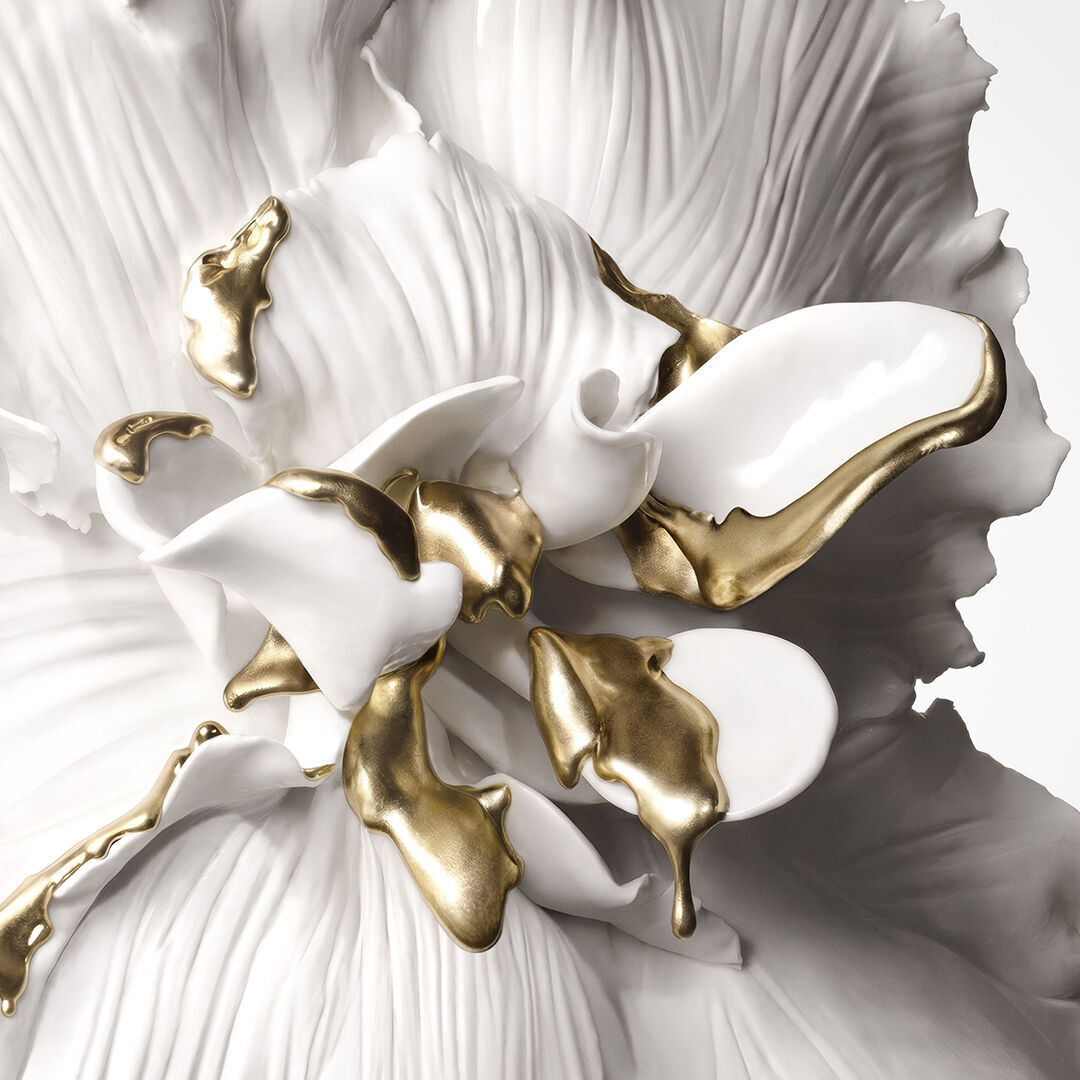 A white sculpted flower with 24K Biotech Gold detailing.