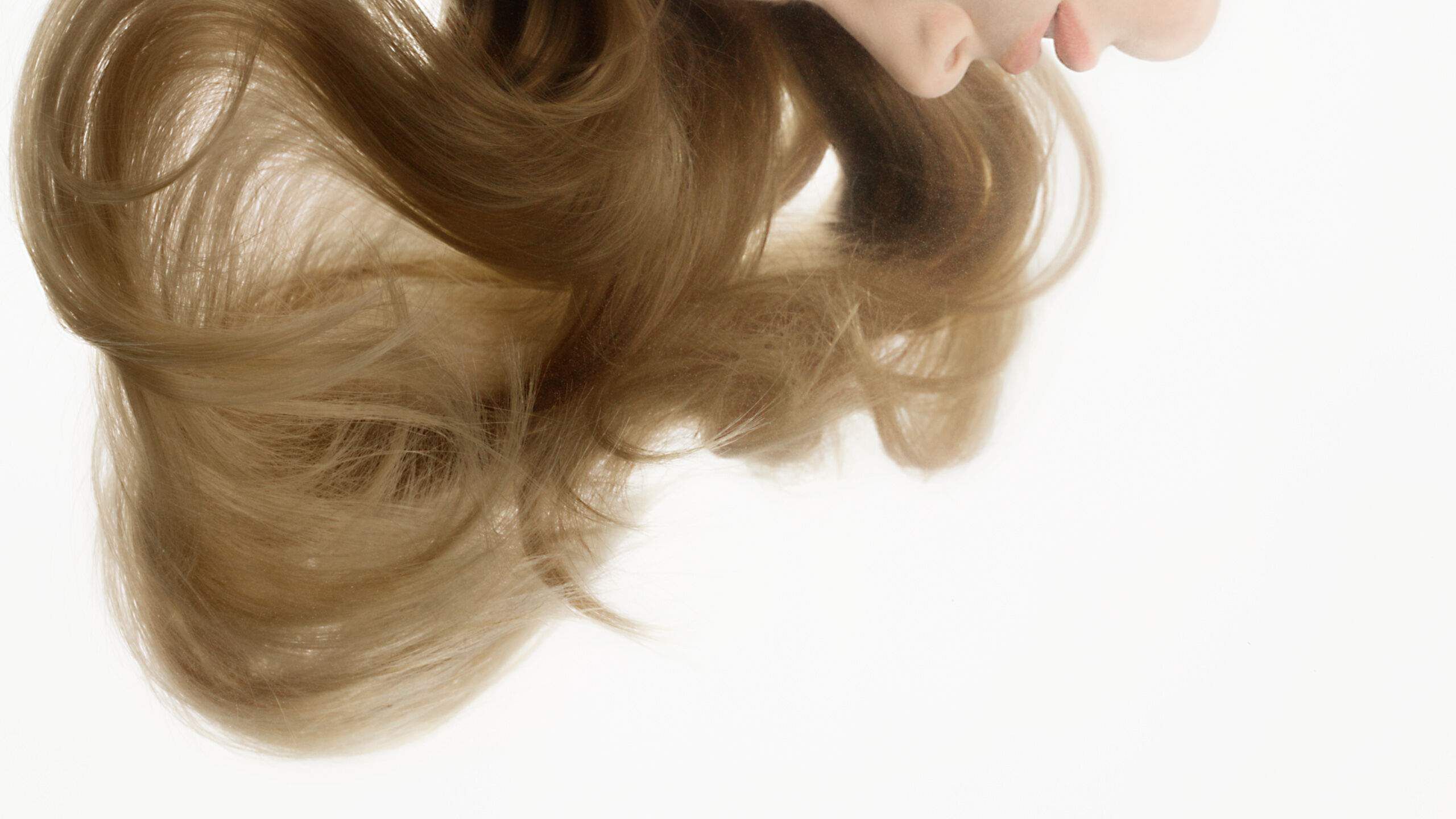 Flowing blonde hair rippling beneath the clear water.