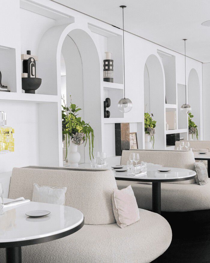 Bright and leafy interior of Rosy & Maria restaurant.