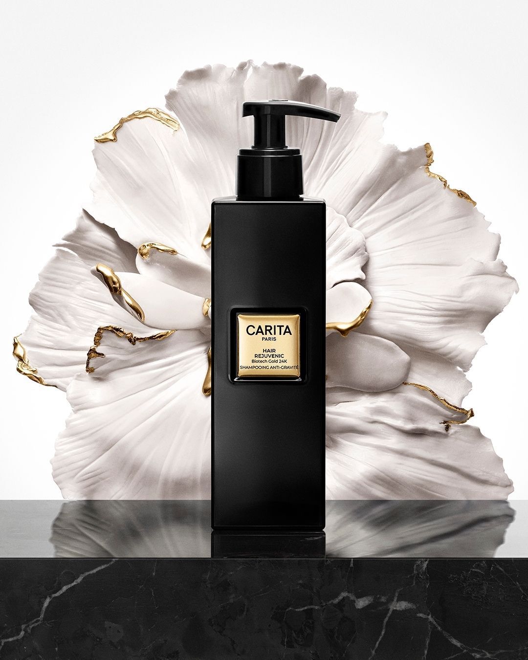 Hair Rejuvenic Anti-Gravity Shine Shampoo, pictured in front of a flower.