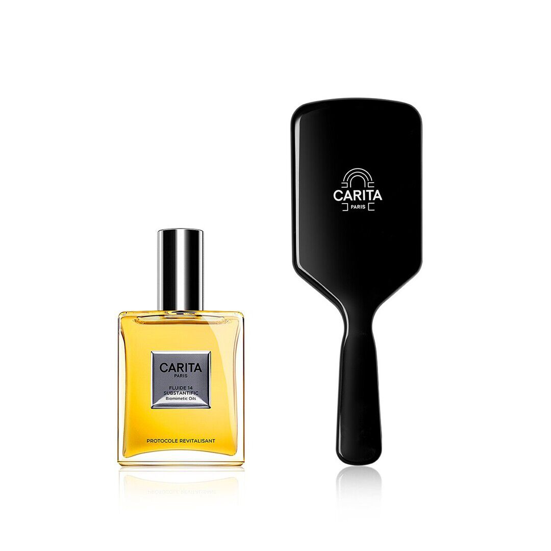 A golden Carita "Protocole Revitalisant" oil, accompanied by a black Carita Paris branded brush. A luxurious duo for a complete hair ritual, symbolizing care and the perfection of radiant hair.