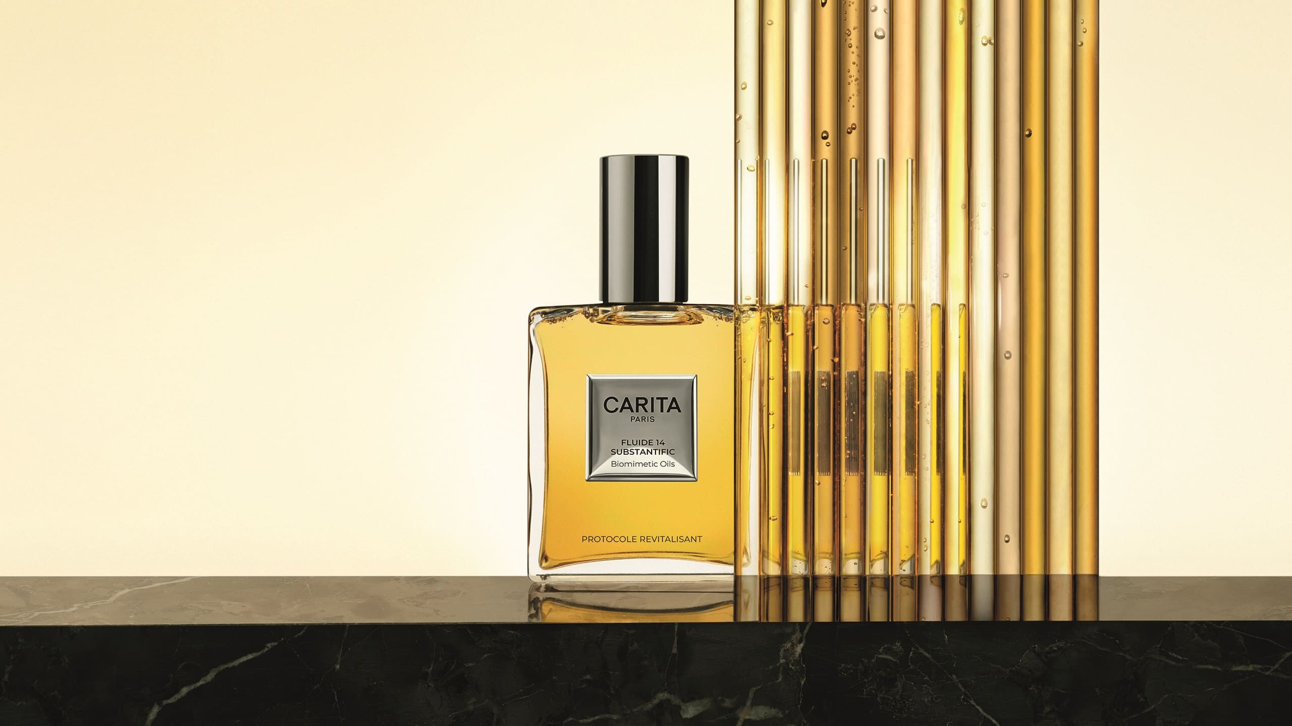 The iconic Fluide 14 Substantific bottle set on precious marble, in front of gold-infused glass test tubes. A staging blending high science and absolute luxury.