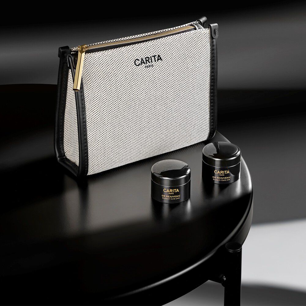 Carita skincare bag and three Or Rejuvenic black product jars.​