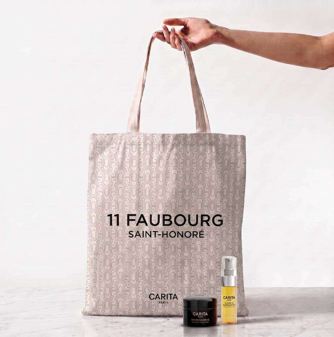 Carita skincare bag and three Or Rejuvenic black product jars.​