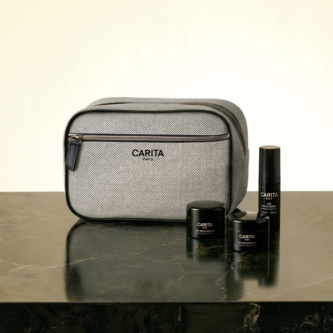 Carita skincare bag and three Or Rejuvenic black product jars.​